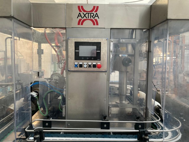 Used Axtra filling monoblock with labeller 2