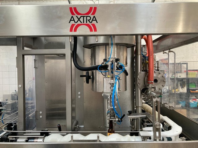 Used Axtra filling monoblock with labeller 3