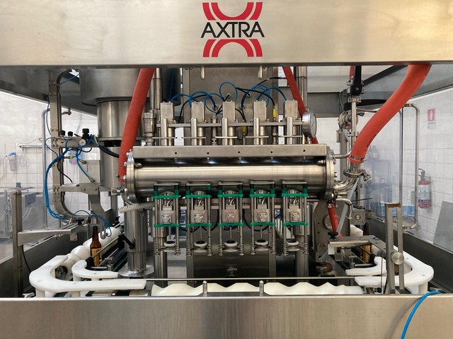 Used Axtra filling monoblock with labeller 5