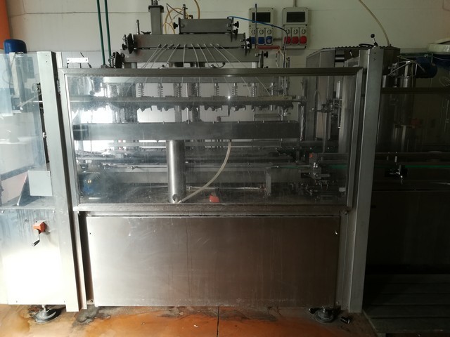 Used Polaris 10.10.1 filling monoblock with adhesive and cold glue labeller