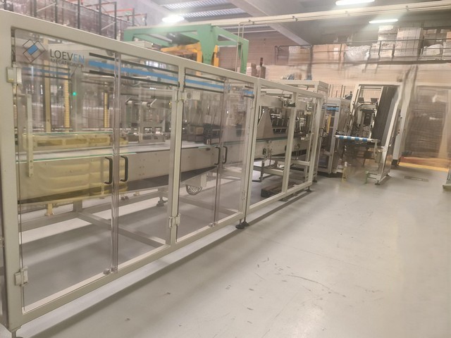 Used hot melt wrap Around Loeven 6
